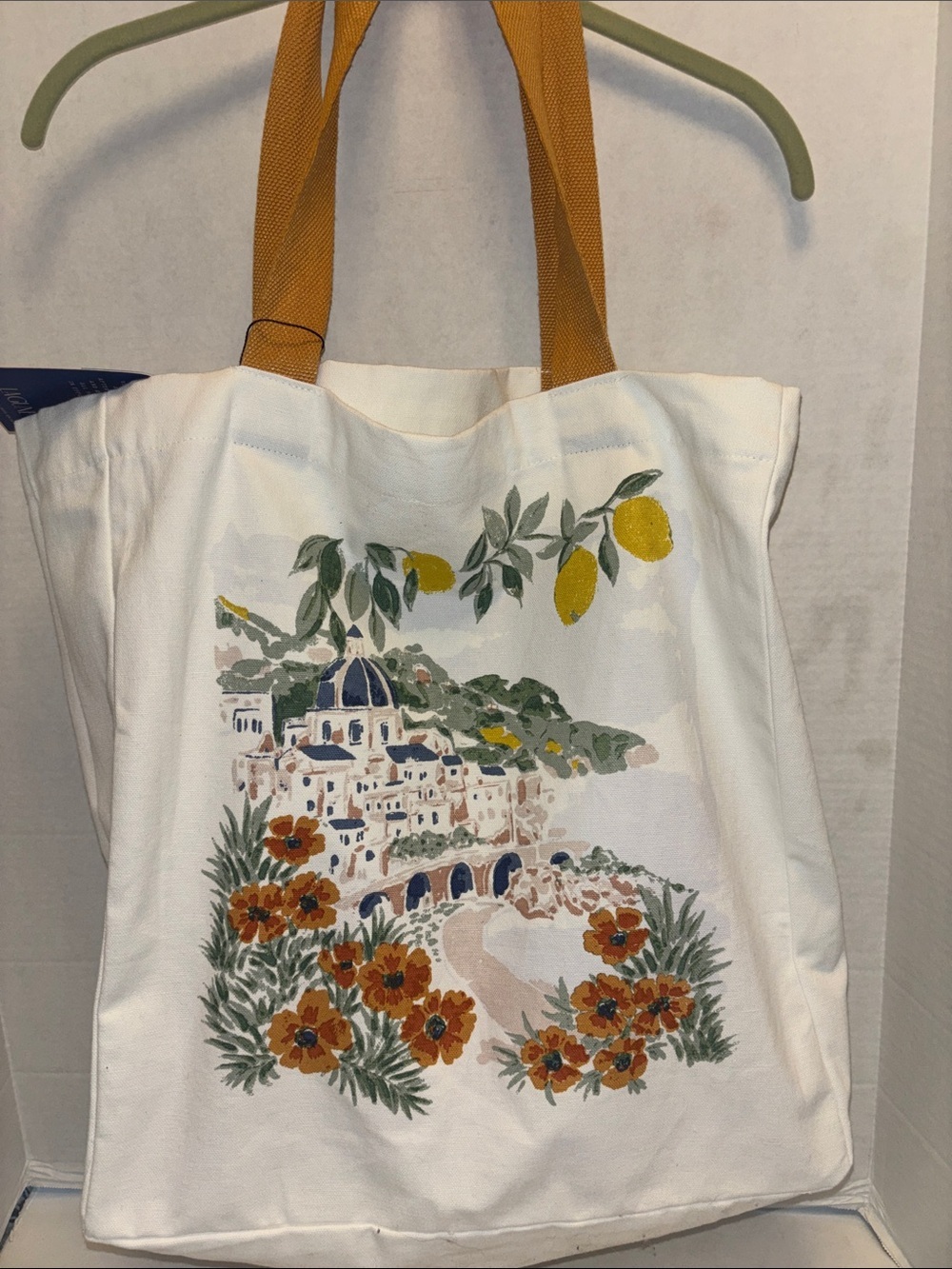 LAGUNE BRAND…WHITE CANVAS TOTE BAG WITH COASTAL VILLAGE SCENE FLORA AND LEMONS